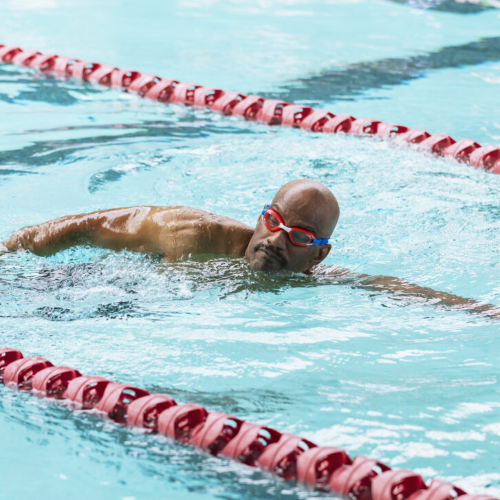 Man swimming in pool