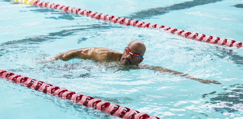 Man swimming in pool