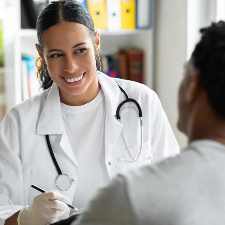Female Doctor Speaking with Male