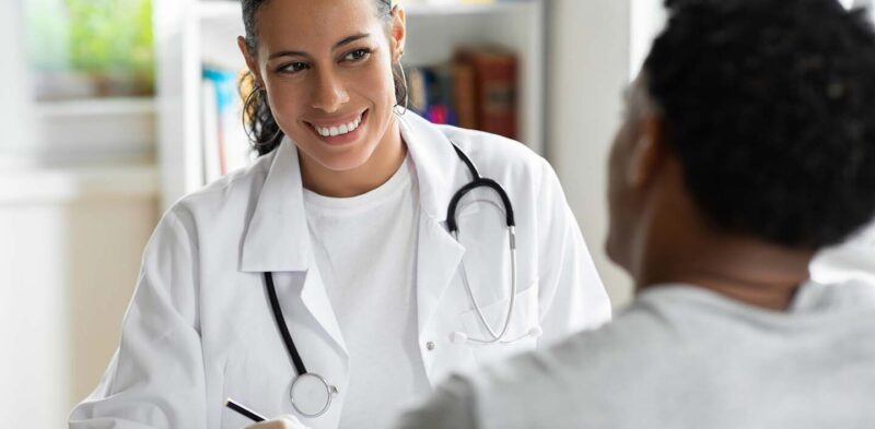 Female Doctor Speaking with Male